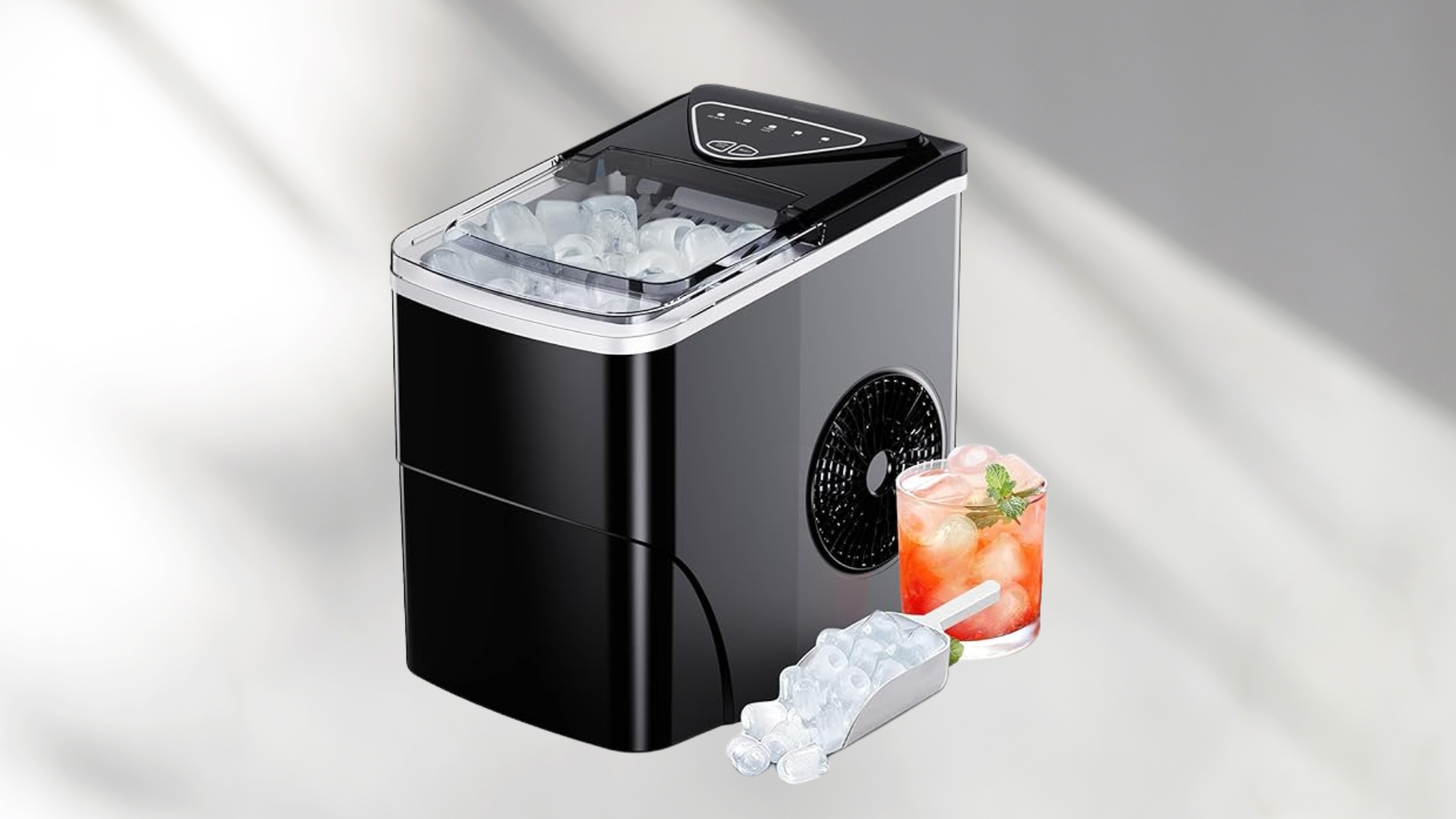 Ice maker with a red iced tea and ice on side on a cool toned background