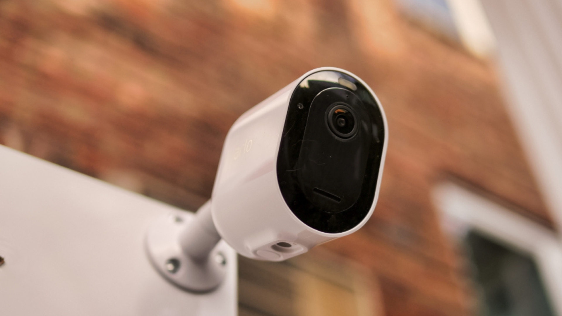 Black and white outdoor security cameras with sleek, modern designs.