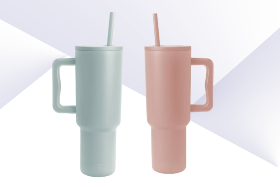 Two tall tumbler cups with handles and straws, one in light blue and the other in light pink, set against a minimalist, geometric background.