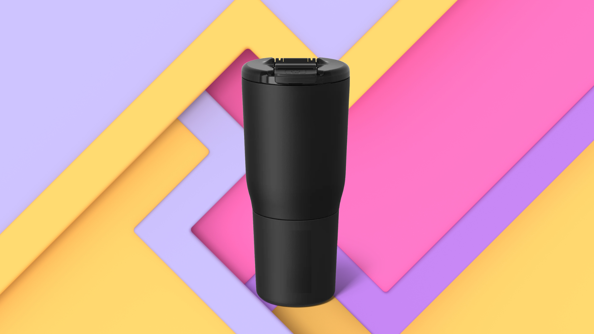 A black tumbler cup with a closed lid, set against a colorful, layered background featuring yellow, pink, and purple geometric shapes.