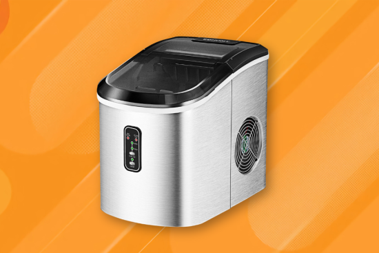 A stainless steel countertop ice maker with a digital display and side ventilation, set against an orange, gradient background with subtle patterns.