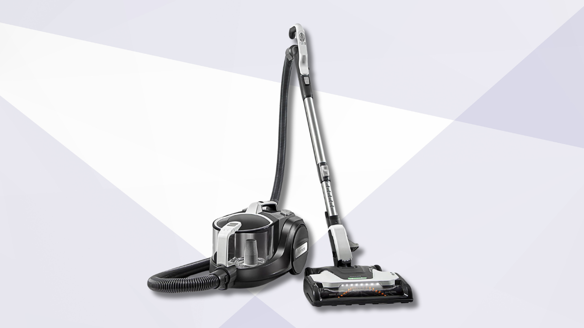 A sleek canister vacuum cleaner with a flexible hose and motorized floor head, displayed against a modern geometric background in shades of white and light gray.