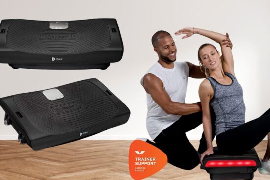 A black LifePro Rumblex 4D Pro Vibration Plate with a trainer assisting a woman stretching on it.