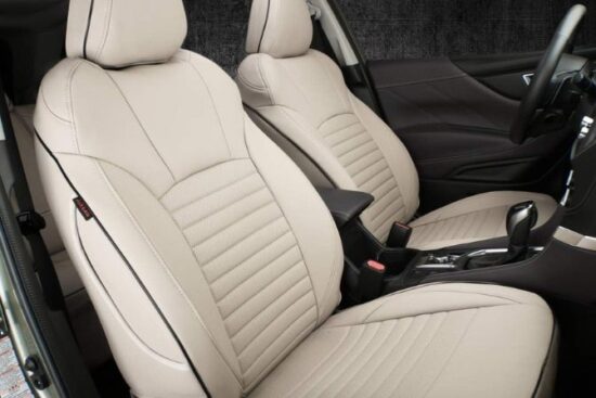 A Subaru Forester interior featuring EKR Custom Fit Forester Car Seat Covers in a sleek beige design.