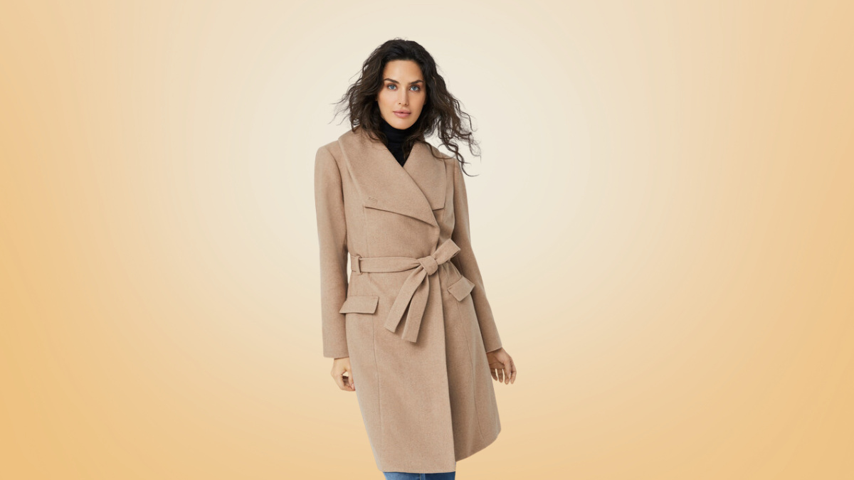 A woman wearing a sophisticated camel-colored wrap coat with a belted waist and wide lapels, ideal for an elegant winter look.