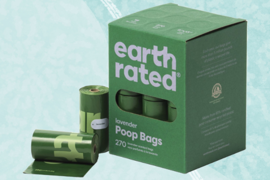 A box of Earth Rated lavender-scented poop bags, with multiple green rolls displayed against a light blue background.