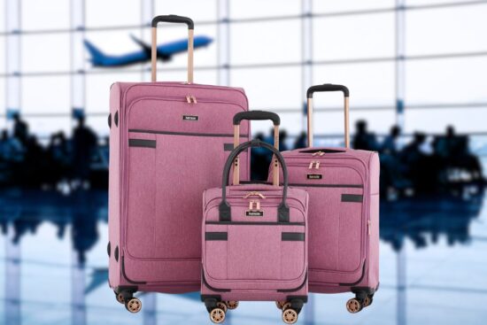 The Kensie Hudson Softside Spinner Luggage Set includes three pink suitcases with smooth-rolling wheels and easy-to-pull handles.