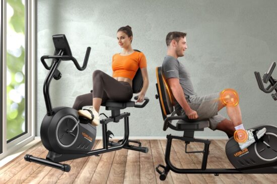 A man and a woman are using YOSUDA PRO recumbent exercise bikes in a bright indoor space with wooden flooring.