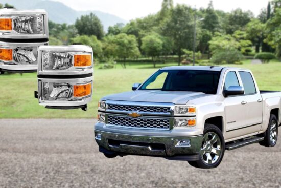 A white Chevy Silverado 1500 is parked outdoors with a set of replacement headlights displayed beside it.