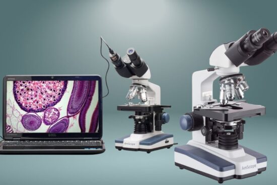 A professional AmScope B120 LED binocular microscope with high magnification, a sturdy design, and a USB camera connected to a laptop displaying a magnified specimen.