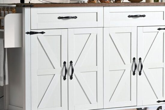 A white farmhouse-style rolling kitchen island with black metal handles, barn-style cabinet doors, drawers, a towel rack, and a spice shelf.