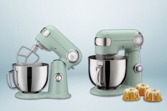 A retro-style stand mixer in pastel green with a stainless steel mixing bowl, tilt-head design, and speed control.