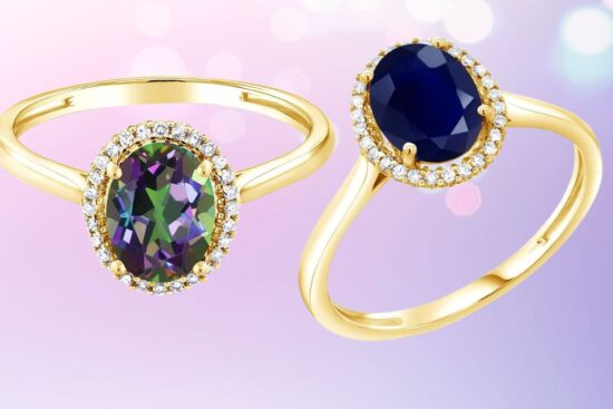 Two gold rings with oval gemstones, one with a deep blue stone and the other with a multicolor stone, both surrounded by small diamonds.
