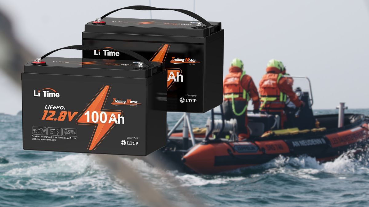 Two LiTime 12V 100Ah LiFePO4 batteries float in the foreground, with a rescue boat and crew in life jackets moving through the water in the background.