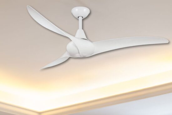 A sleek white ceiling fan with three curved blades is mounted on a modern ceiling with soft ambient lighting.