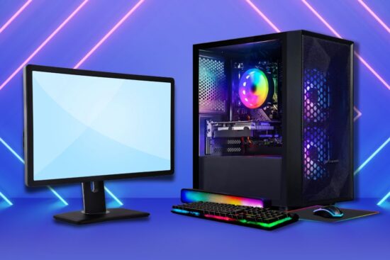 A gaming desktop setup with a monitor, RGB keyboard, mouse, and a tower case with colorful lighting.