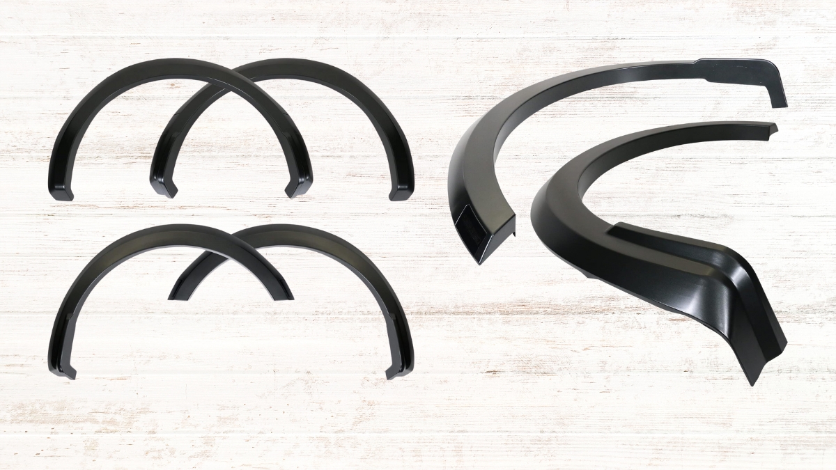 A set of black fender flares for the 2021-2024 Ford F-150, designed for a rugged look and extra protection against mud and debris.