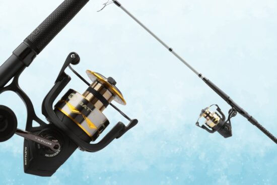 A spinning reel and rod combo with a black and gold design, featuring a strong handle and smooth spool, set against a light blue background.