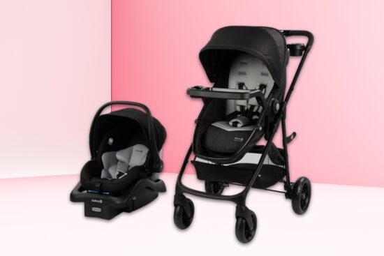 A black Safety 1st Grow and Go Flex 8-in-1 Travel System with a stroller and infant car seat set against a pink and white background.