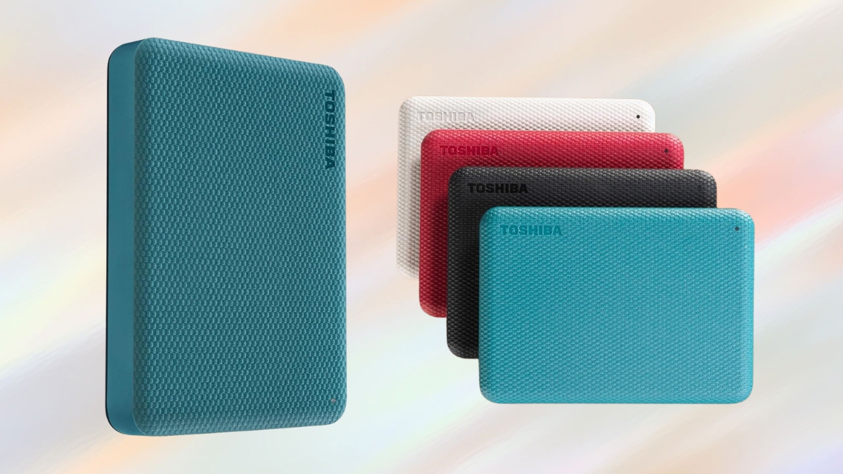 Toshiba Canvio external hard drives in teal, black, red, and white with a textured surface, shown against a soft gradient background.