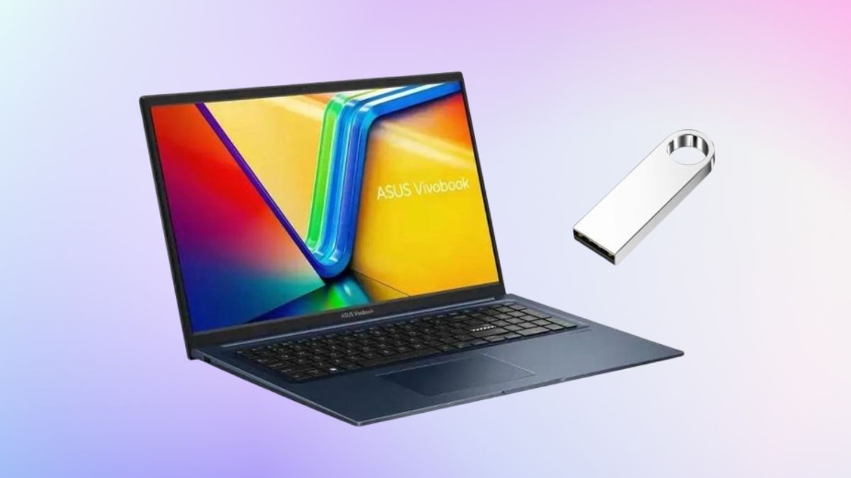 Blue ASUS Vivobook 17-inch laptop with a colorful screen and a silver USB drive floating beside it on a soft gradient background.