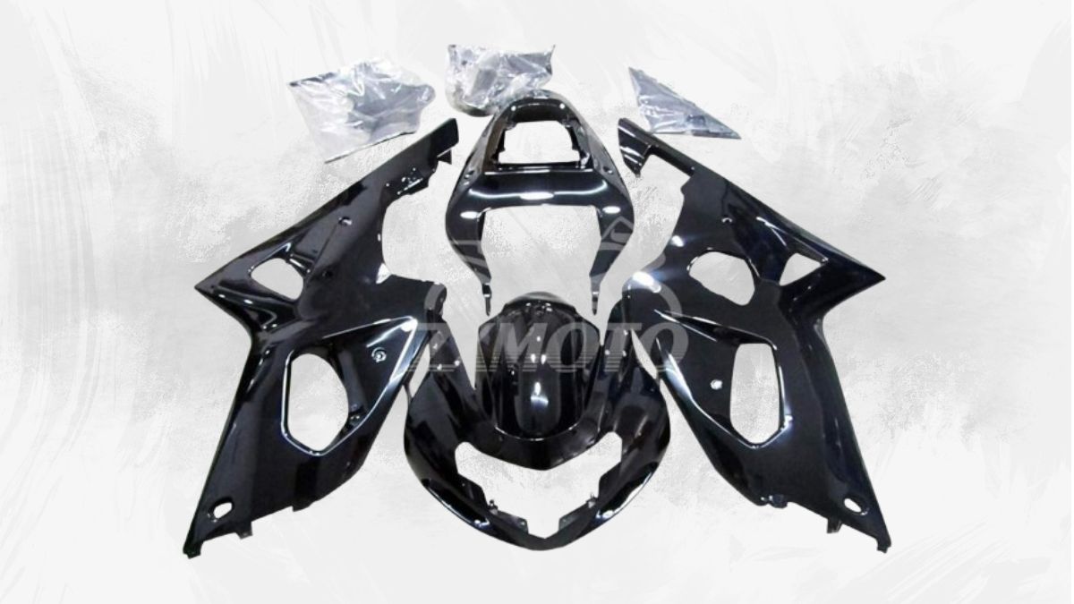 Glossy black ZXMOTO Suzuki GSXR 1000 Fairings Kit laid out, showing pre-drilled ABS plastic body panels for easy installation.