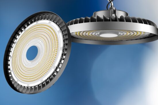 A round LED high bay light with a silver heat sink, showing its detailed inner structure and hanging from a hook.