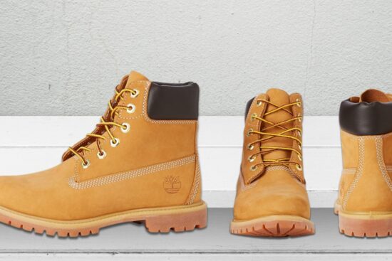 Timberland women’s work boots with yellow laces, black padded collars, and rubber soles shown from the side, front, and back.