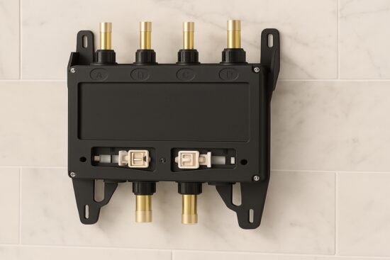 Moen S3104 smart shower valve mounted on a tiled wall with labeled inlets and outlets for four water connections.