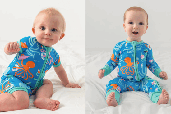 Two babies sitting on a white bed, each wearing blue pajamas with orange octopus and ocean-themed designs.