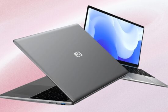 two gray CFVOCUY 15.6 inch Windows 11 laptops showing open screen and closed lid on soft pink background