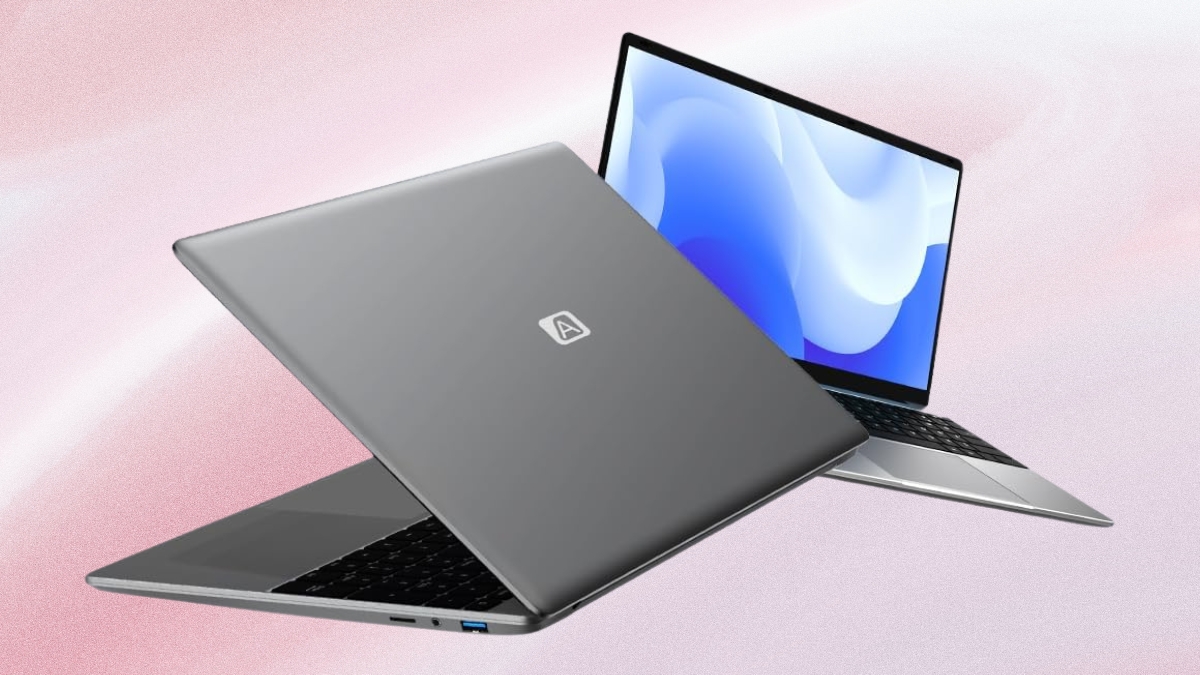 two gray CFVOCUY 15.6 inch Windows 11 laptops showing open screen and closed lid on soft pink background