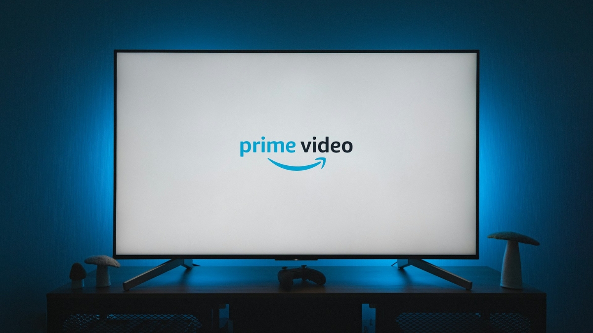 TV screen displaying the Amazon Prime Video logo with a gaming controller on the table.