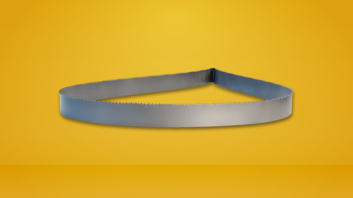 Metal Lenox band saw blade with sharp teeth, shaped in a loop, shown on a yellow background.