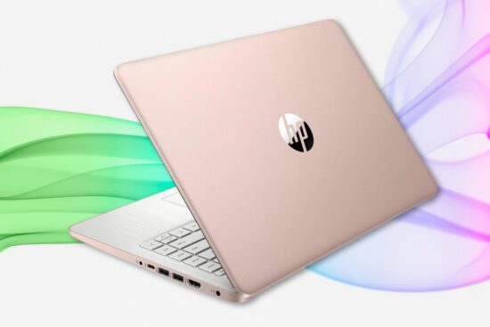 Rose gold HP laptop slightly open with white keyboard and colorful wave background.