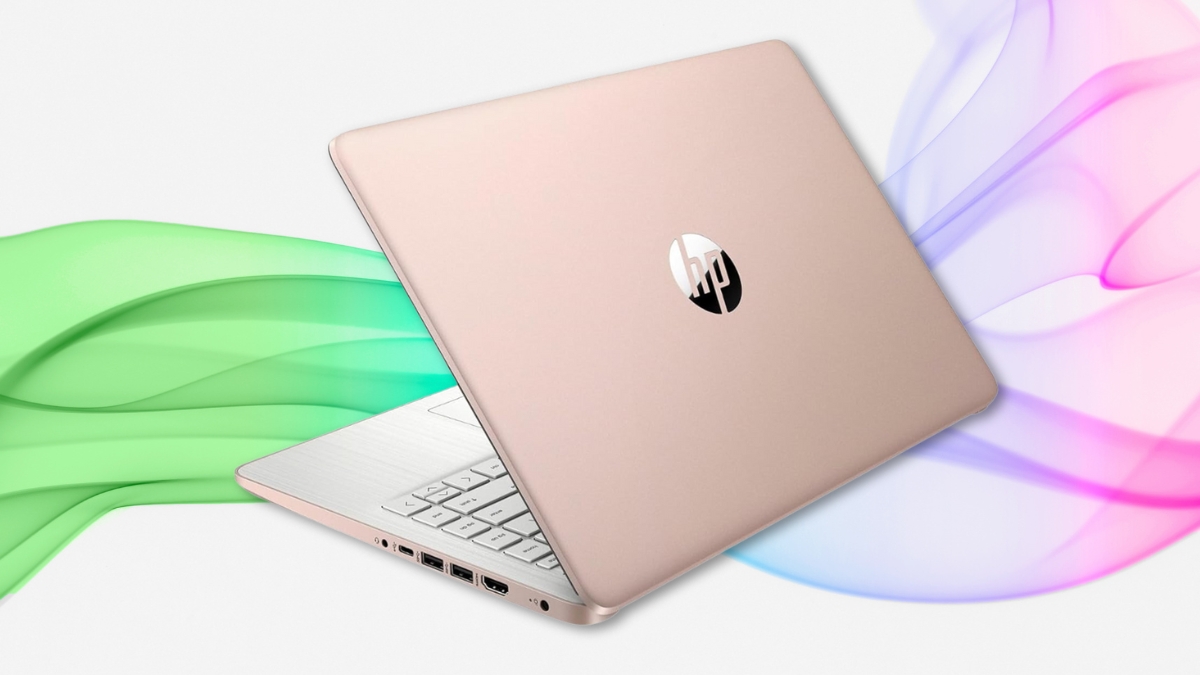 Rose gold HP laptop slightly open with white keyboard and colorful wave background.