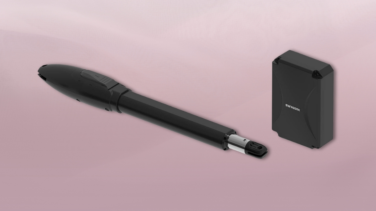 Black automatic gate opener with swing arm and control box shown on a soft pink background.