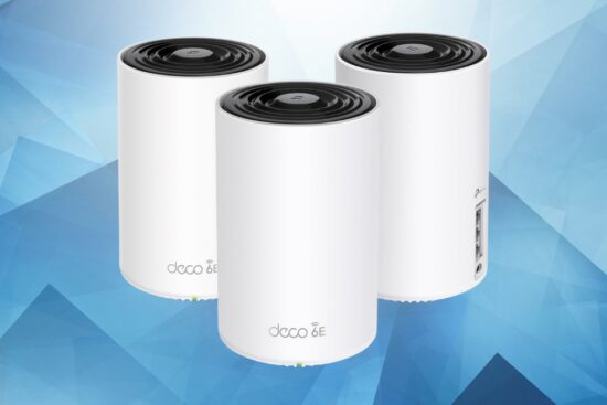 Three TP-Link Deco XE75 mesh system units shown on a blue background with visible Ethernet ports.