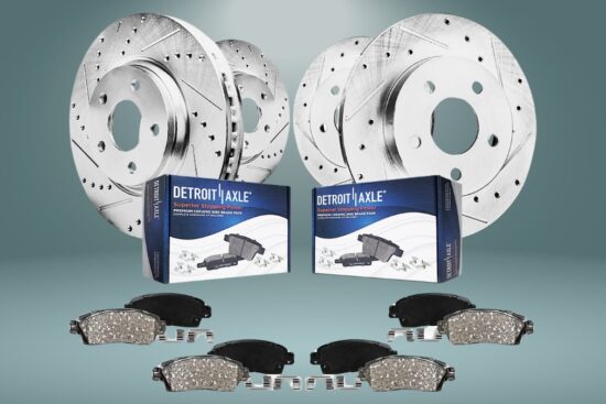 Detroit Axle brake kit with drilled slotted rotors and ceramic brake pads shown with packaging and hardware.