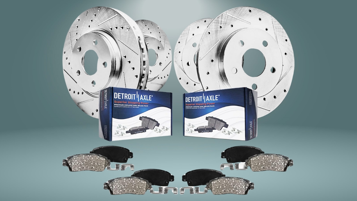 Detroit Axle brake kit with drilled slotted rotors and ceramic brake pads shown with packaging and hardware.