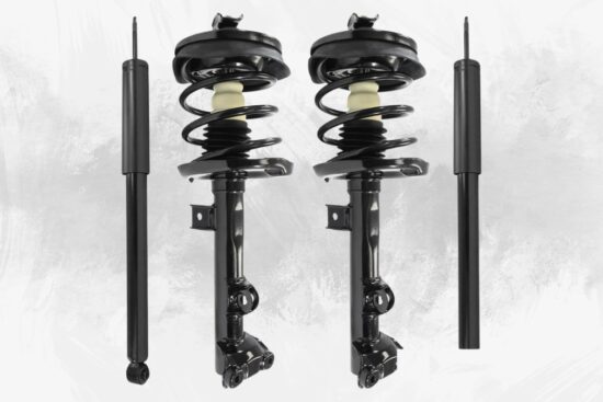 Two front strut assemblies and two rear shock absorbers for a Mercedes CLK550 suspension kit shown on a light background.