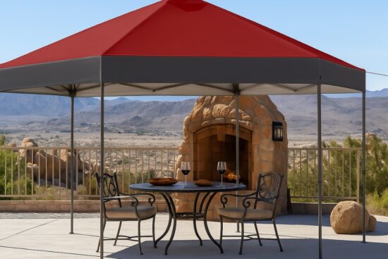 Red and gray CROWN SHADES pop up gazebo set up on a patio with a table and chairs underneath.