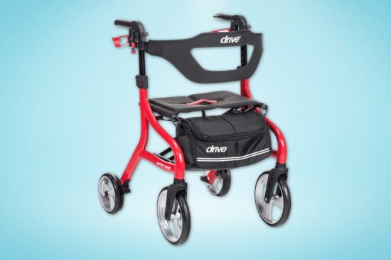 Red Drive Medical rollator walker with seat, storage bag, and large front wheels for easy movement.