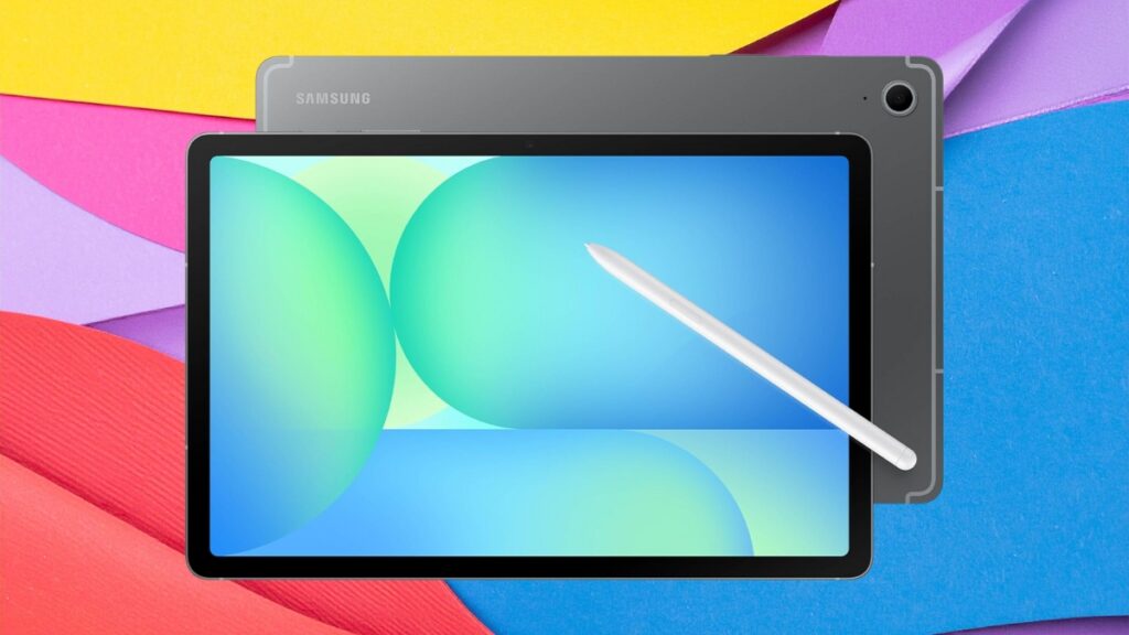 Samsung Galaxy Tab S10 FE tablet with S Pen stylus displayed on a colorful paper background featuring shades of blue, red, pink, yellow, and purple.