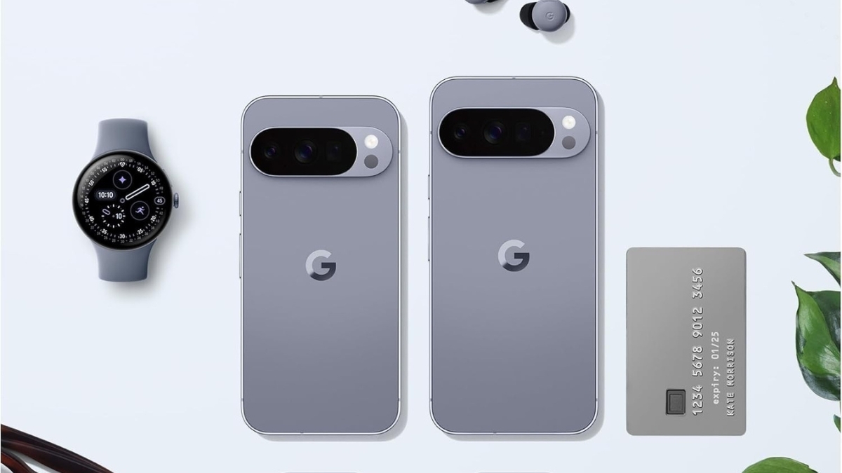 Google Pixel 10 Pro phones in gray color shown with a Pixel Watch, Pixel Buds, and a credit card on a clean flat-lay background.
