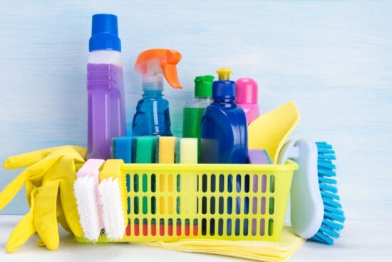 Cleaning supplies basket with disinfectant sprays, sponges, gloves, and household cleaning products from Amazon Health and Household items
