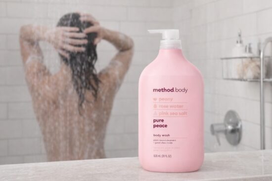 Method Body Wash Pure Peace bottle in a modern shower setting, featuring rose water, peony, and pink sea salt scent with eco-friendly packaging.