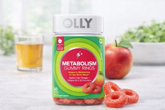 OLLY Metabolism Gummy Rings bottle with apple cider vinegar gummies on table
